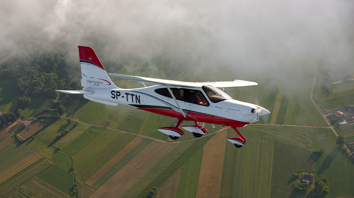 P2010 by Tecnam flying in the sky