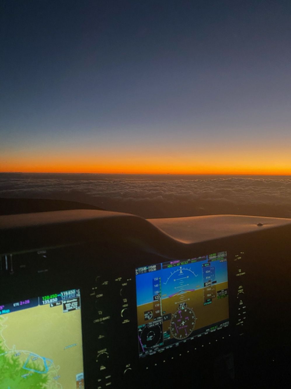 flying during dawn. sunrise and airplane dashboards