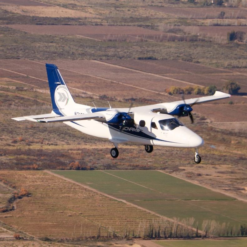 tecnam p2012 traveller flying over argentina fields
